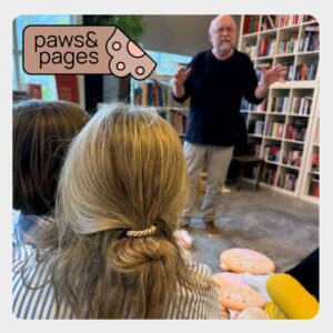 Children seated quietly during Paws & Pages
