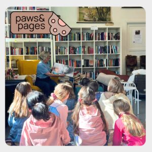 Children entering a library space for a Paws & Pages activity