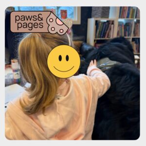 Child sitting beside a dog in a relaxed environment