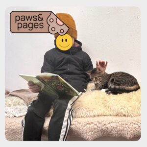 Child seated with a book during a calm reading moment