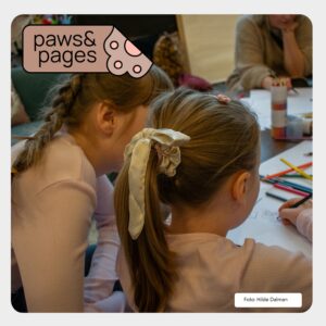 Children gathered around books during a calm reading activity