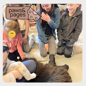 Children petting cats after a reading activity